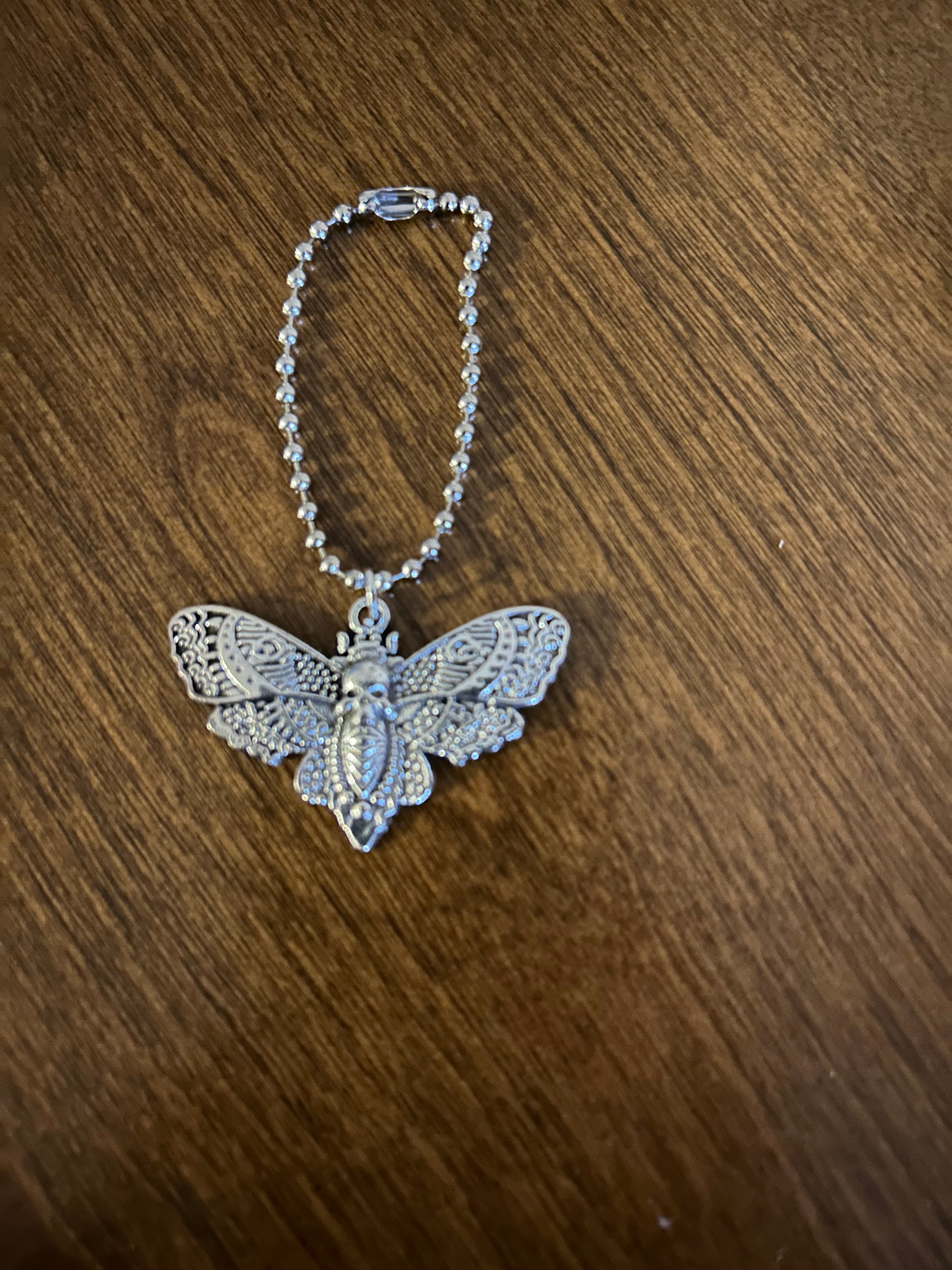 Deadly Demask Handle Charm