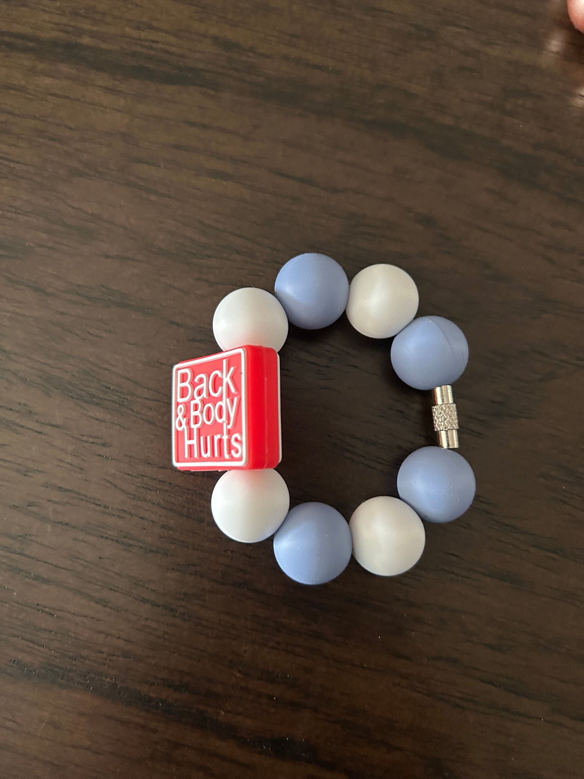 Back and Body Hurts Handle Charm