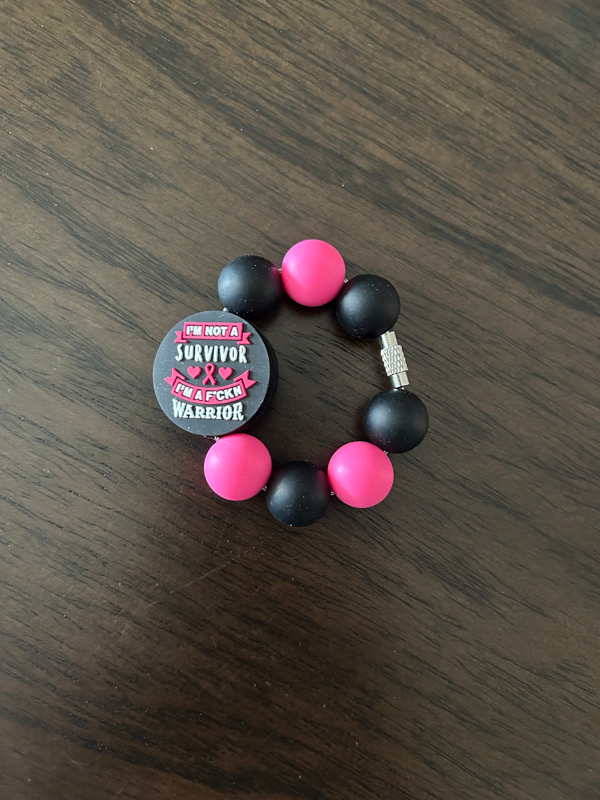 Survivor Handle Charm
