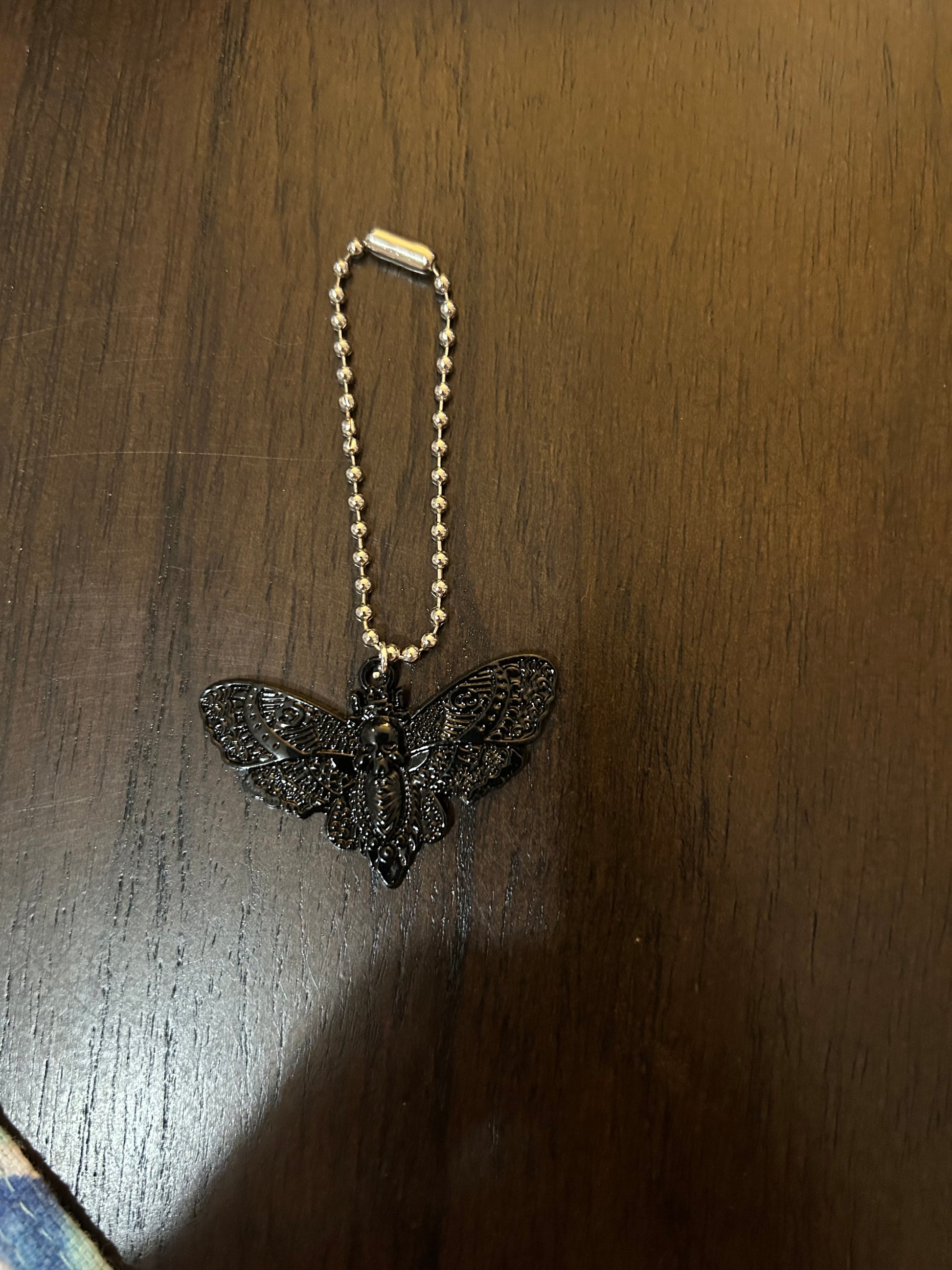 Deadly Demask Handle Charm