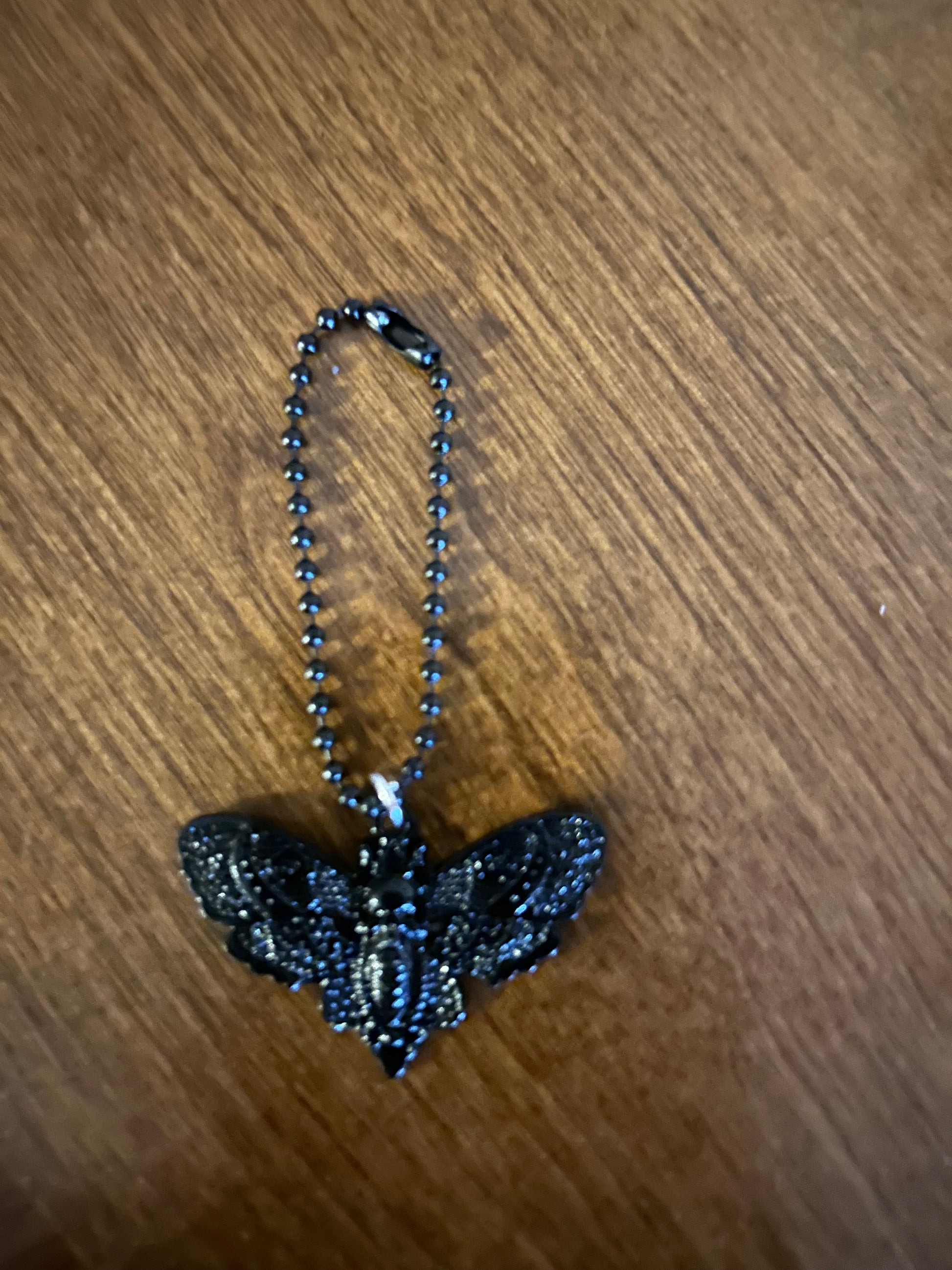 Deadly Demask Handle Charm